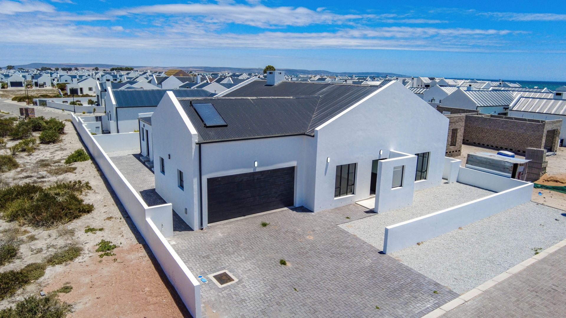 Modern Coastal Home with Separate Guest Suite in Secure Estate