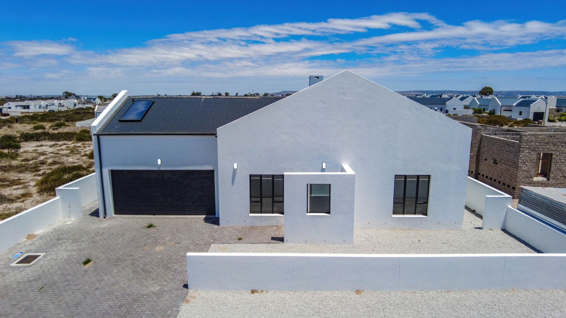 Modern Coastal Home with Separate Guest Suite in Secure Estate