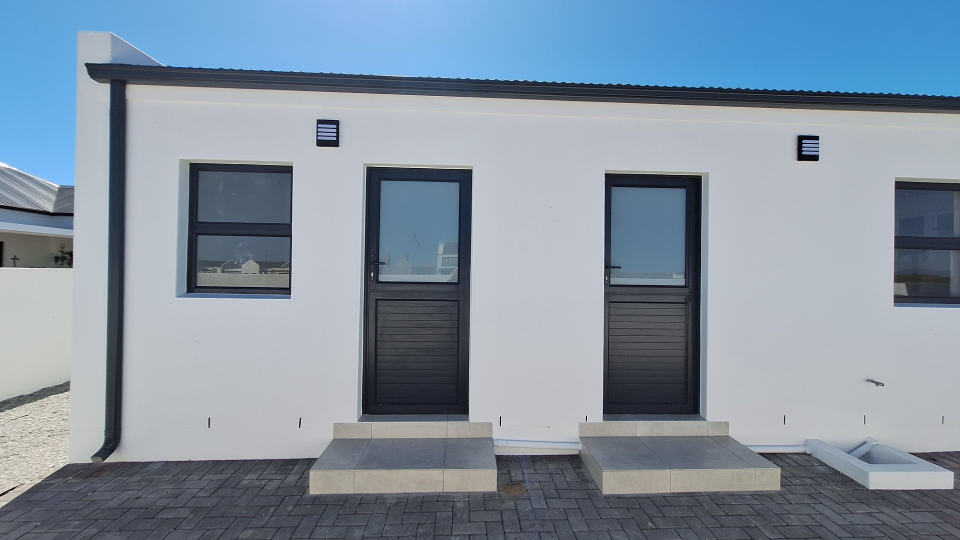 Modern Coastal Home with Separate Guest Suite in Secure Estate