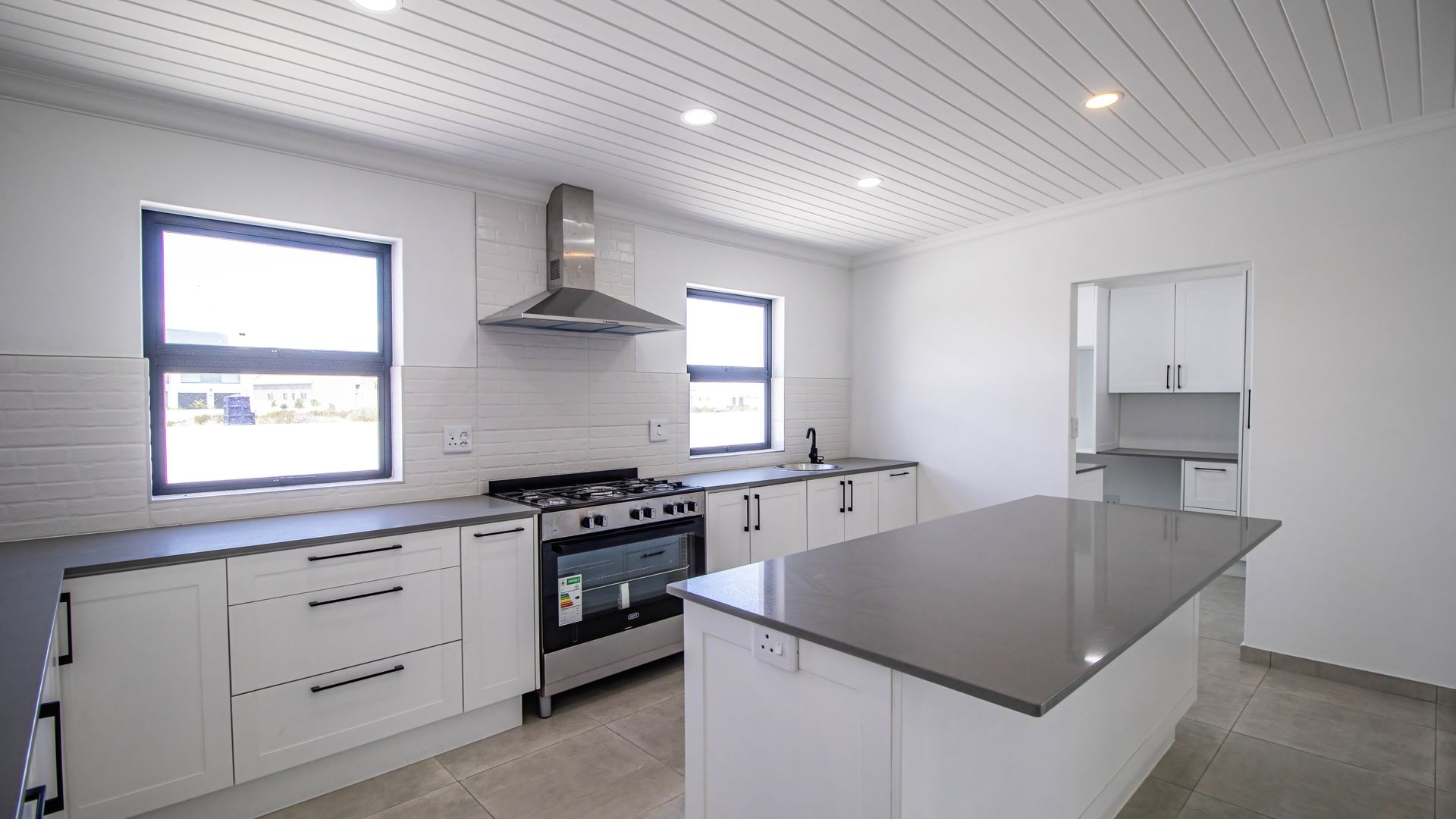 Modern Coastal Home with Separate Guest Suite in Secure Estate